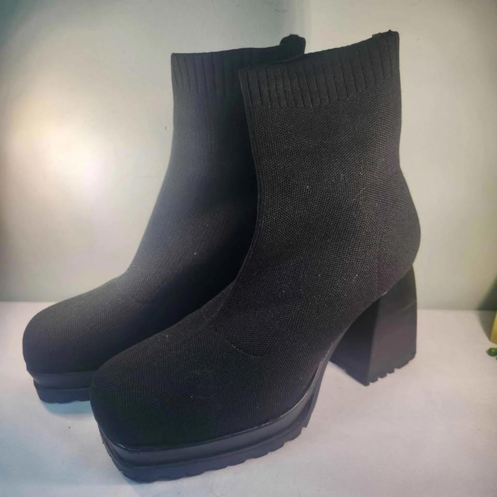 Black square toe sock platform boots.